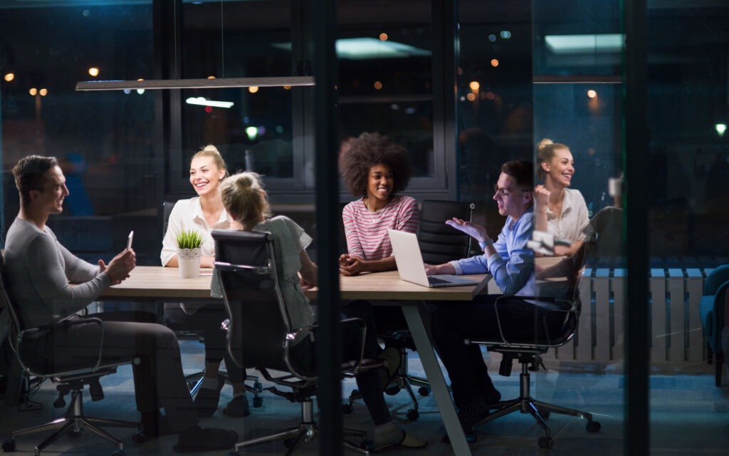 Digital marketing team in a late evening strategy meeting
